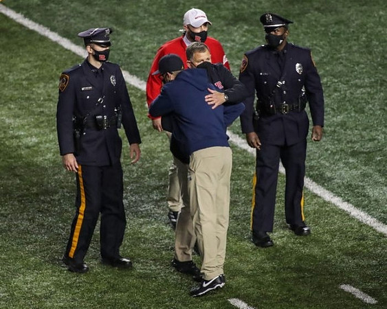 Rutgers Head Coach Greg Schiano and Jim Harbaugh