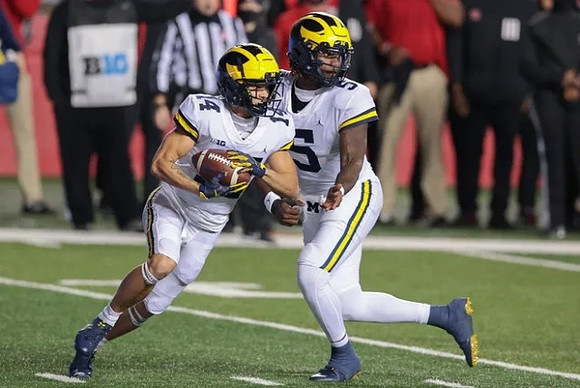 Roman Wilson (14) and Joe Milton (5)