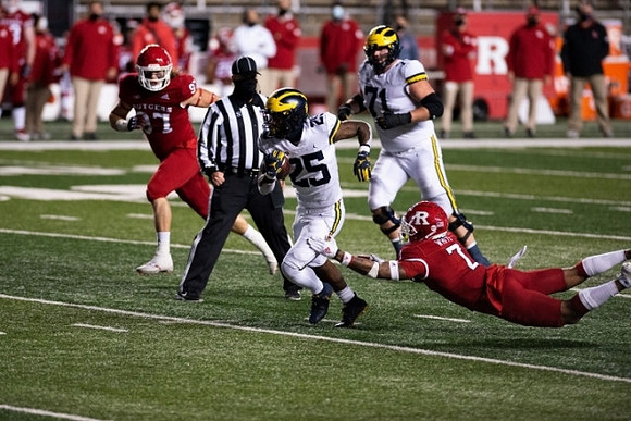 Hassan Haskins (25) and Andrew Stueber (71)