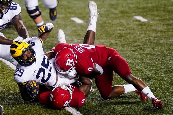 Nick Eubanks (82) and Hassan Haskins (25)