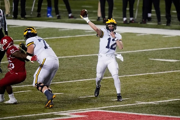 Andrew Stueber (71) and Cade McNamara (12)