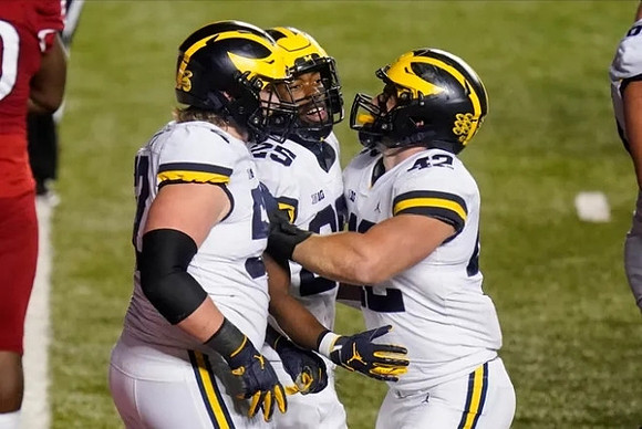 Karsen Barnhart (52), Hassan Haskins (25), and Ben Mason (42)