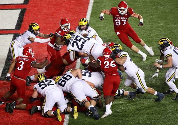 Karsen Barnhart (52), Chuck Filiaga (66), Zach Carpenter (58), Hassan Haskins (25), Andrew Stueber (71), and Cade McNamara (12)