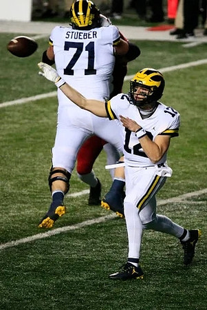 Andrew Stueber (71) and Cade McNamara (12)