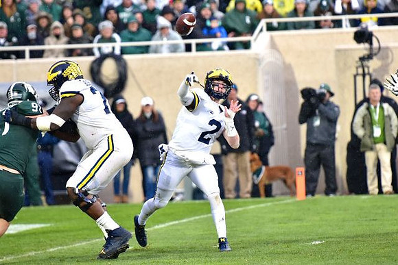 Juwann Bushell-Beatty (76) and Shea Patterson (2)