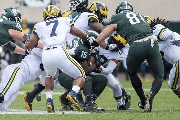 Khaleke Hudson (7), Devin Bush (10), Tyree Kinnel (23), and Devin Gil (36)