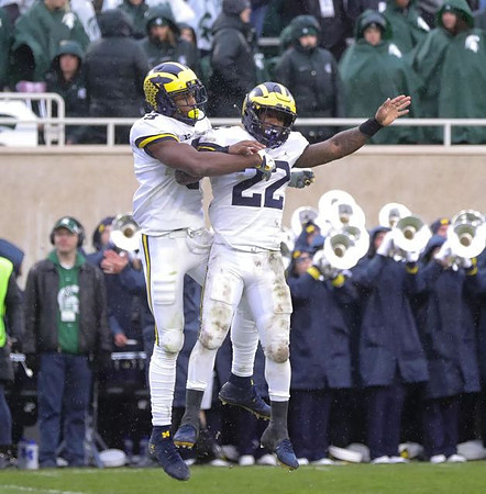 Donovan Peoples-Jones (9) and Karan Higdon (22)