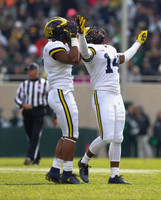 Khaleke Hudson (7) and Josh Metellus (14)