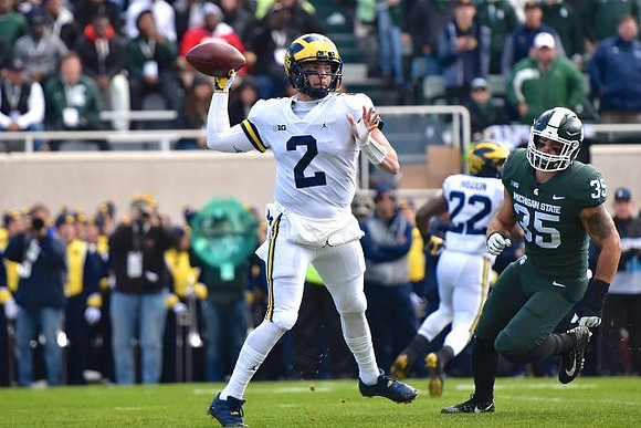Shea Patterson (2) and Karan Higdon (22)