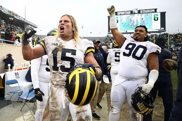 Chase Winovich (15), Bryan Mone (90), and Aubrey Solomon (5)
