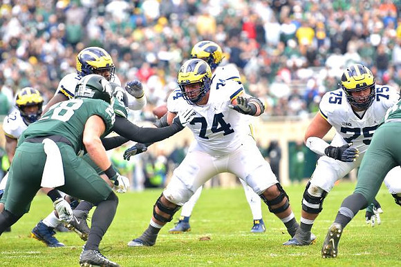 Karan Higdon (22), Shea Patterson (2), Ben Bredeson (74), and Jon Runyan Jr. (75)