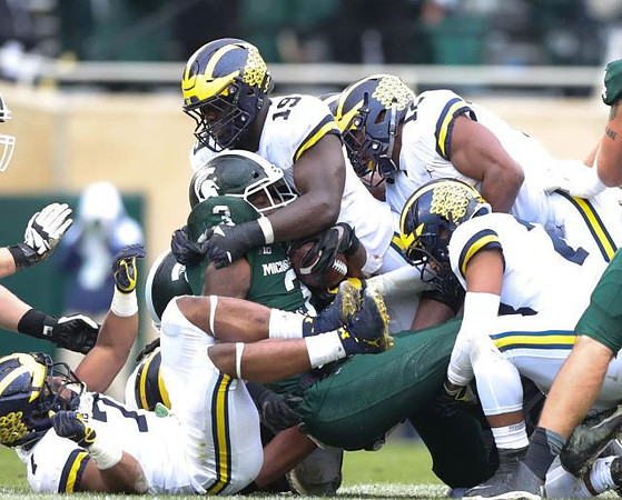 Khaleke Hudson (7), Kwity Paye (19), Josh Ross (12), and Carlo Kemp (2)