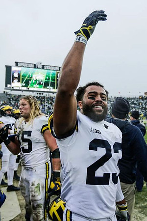 Chase Winovich (15) and Tyree Kinnel (23)
