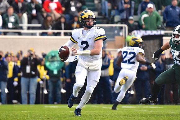 Shea Patterson (2) and Karan Higdon (22)