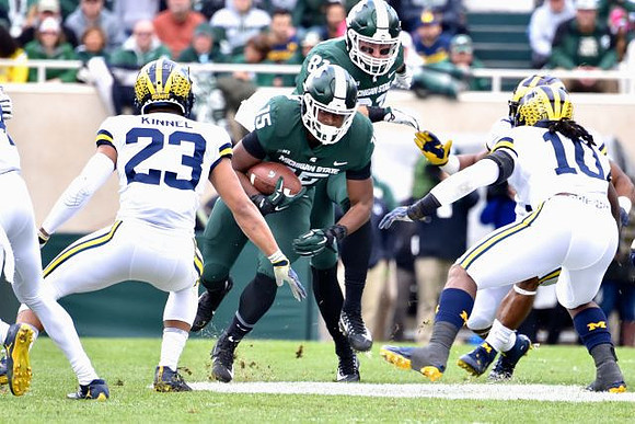 Tyree Kinnel (23) and Devin Bush (10)