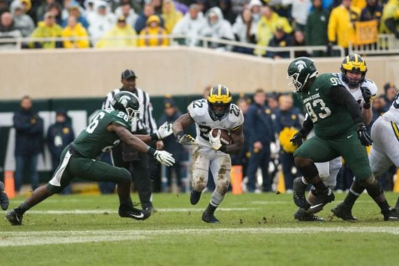 Karan Higdon (22) and Ben Bredeson (74)