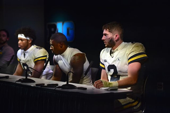 Donovan Peoples-Jones (9), Karan Higdon (22), and Shea Patterson (2)