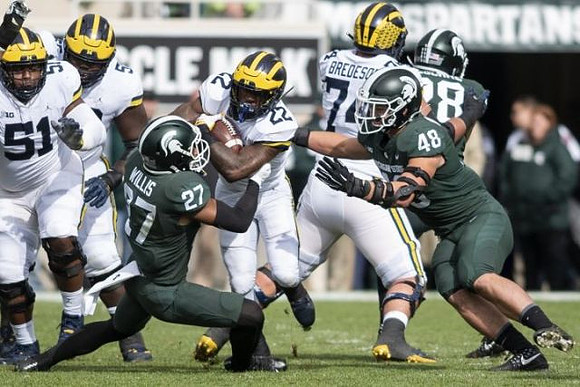 Cesar Ruiz (51), Michael Onwenu (50), Karan Higdon (22), and Ben Bredeson (74)