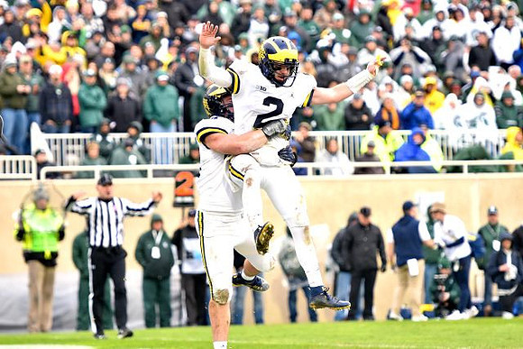 Ben Mason (42) and Shea Patterson (2)