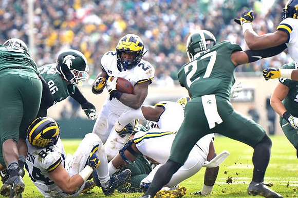 Sean McKeon (84) and Karan Higdon (22)