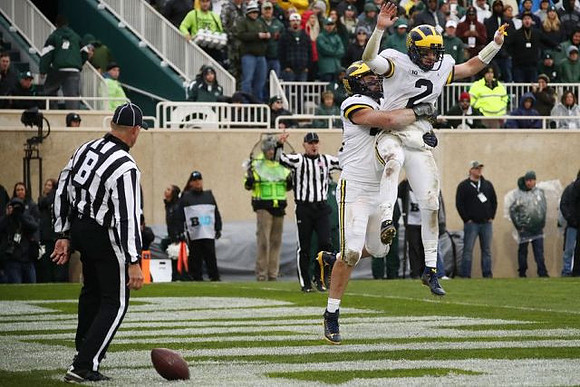 Ben Mason (42) and Shea Patterson (2)