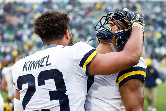 Tyree Kinnel (23) and Khaleke Hudson (7)
