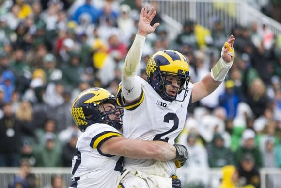 Ben Mason (42) and Shea Patterson (2)