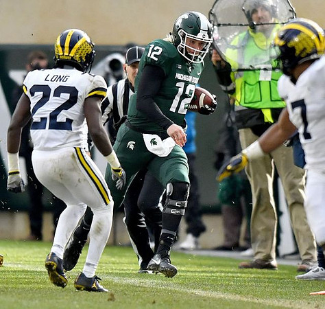 David Long (22) and Khaleke Hudson (7)