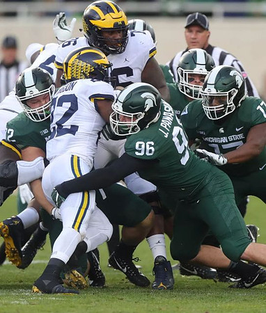 Karan Higdon (22) and Juwann Bushell-Beatty (76)