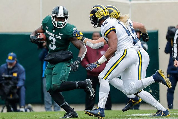 Josh Ross (12) and Chase Winovich (15)