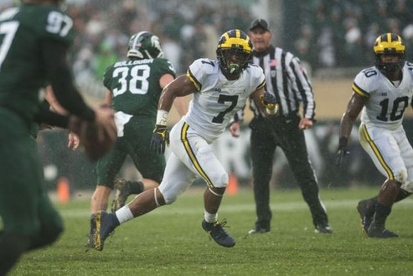 Khaleke Hudson (7) and Devin Bush (10)
