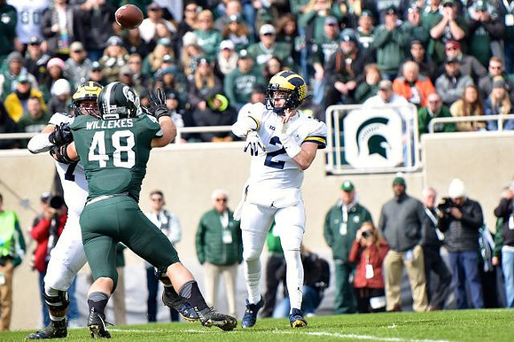 Jon Runyan Jr. (75) and Shea Patterson (2)