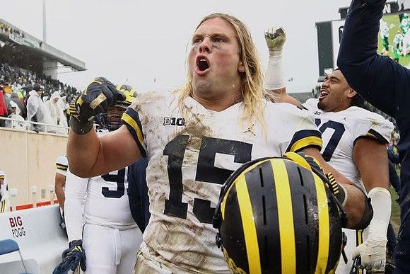 Chase Winovich (15) and Bryan Mone (90)