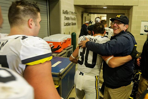 Tyler Cochran (30) and Jim Harbaugh