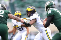 Brandon Watson (28) and Josh Uche (6)