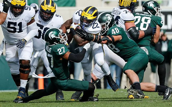 Cesar Ruiz (51), Michael Onwenu (50), Karan Higdon (22), and Ben Bredeson (74)