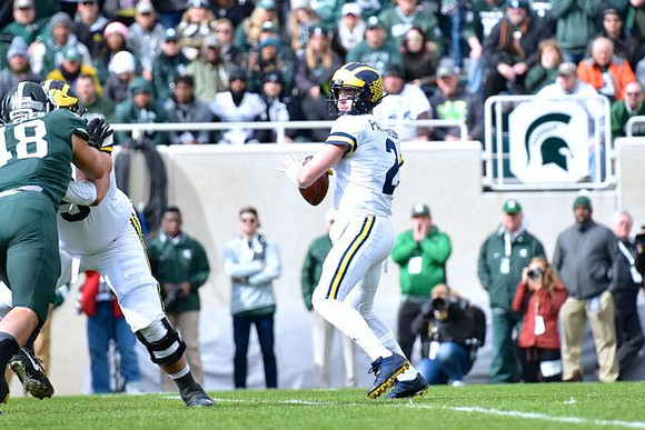 Jon Runyan Jr. (75) and Shea Patterson (2)