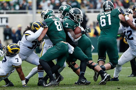 Khaleke Hudson (7), Devin Gil (36), and Josh Ross (12)