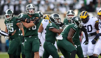 Jon Runyan Jr. (75) and Michael Onwenu (50)