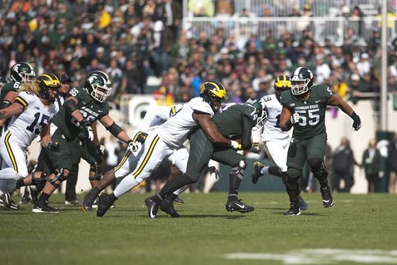 Chase Winovich (15), Josh Uche (6), and Kwity Paye (19)