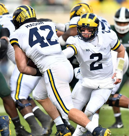 Ben Mason (42) and Shea Patterson (2)