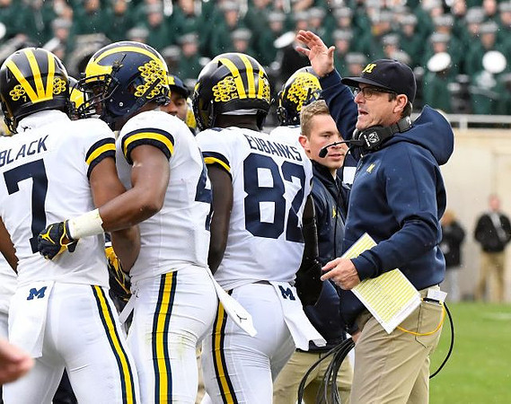 Tarik Black (7), Nico Collins (4), Nick Eubanks (82), and Jim Harbaugh