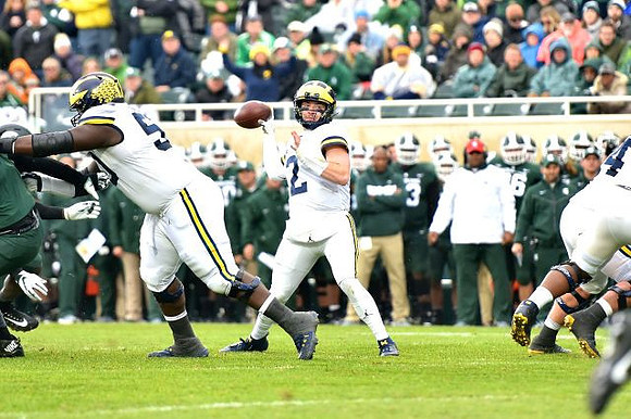 Michael Onwenu (50) and Shea Patterson (2)
