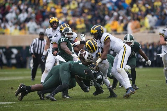 Sean McKeon (84) and Karan Higdon (22)