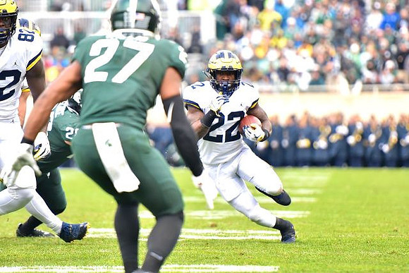 Nick Eubanks (82) and Karan Higdon (22)