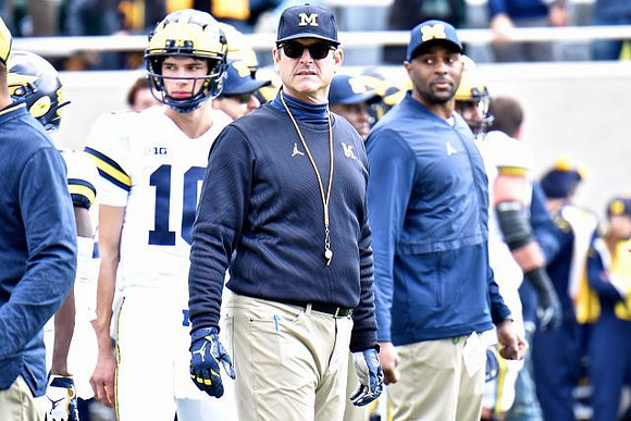 Dylan McCaffrey (10) and Jim Harbaugh
