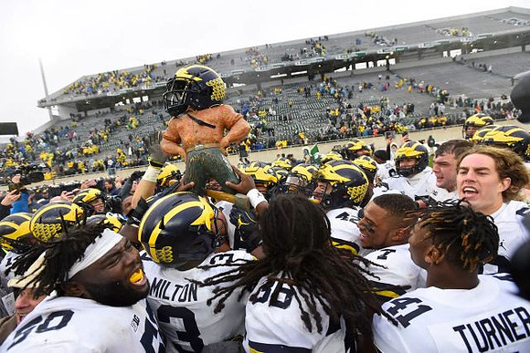 Michigan Team and Paul Bunyan Trophy