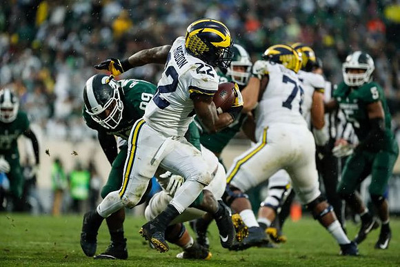 Karan Higdon (22) and Juwann Bushell-Beatty (76)