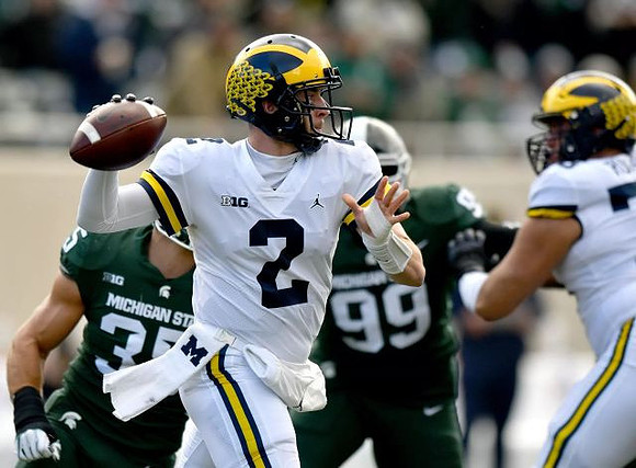 Shea Patterson (2) and Jon Runyan Jr. (75)