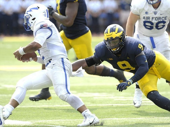 Mike McCray (9) and Rashan Gary (3)